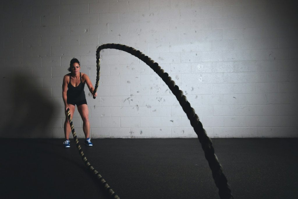 woman holding brown ropes